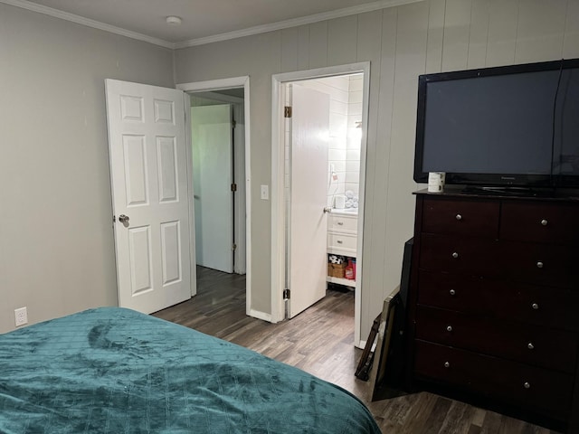 bedroom featuring dark hardwood / wood-style flooring and ornamental molding