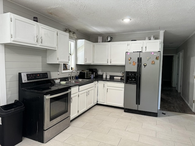 kitchen featuring white cabinetry, stainless steel appliances, and sink