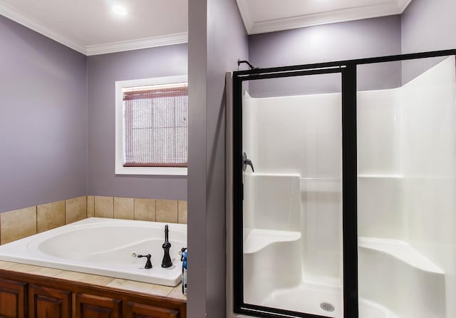 bathroom featuring ornamental molding and independent shower and bath