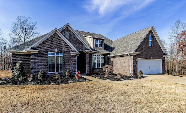 view of front facade with a garage and a front yard