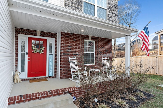 doorway to property featuring covered porch