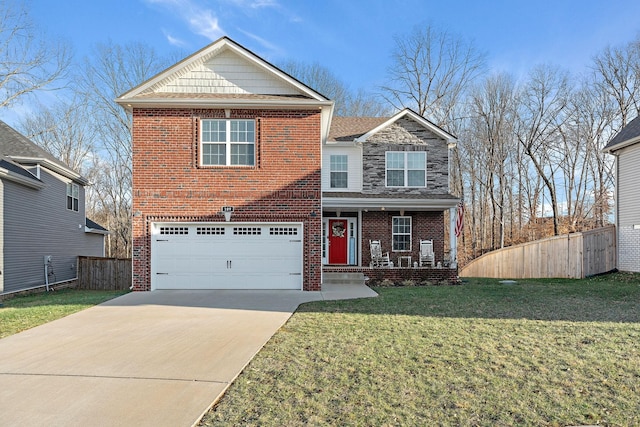 view of front property featuring a garage, a porch, and a front yard