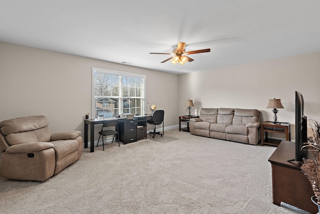 living room featuring light carpet and ceiling fan