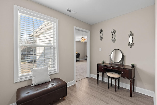 sitting room featuring light hardwood / wood-style floors