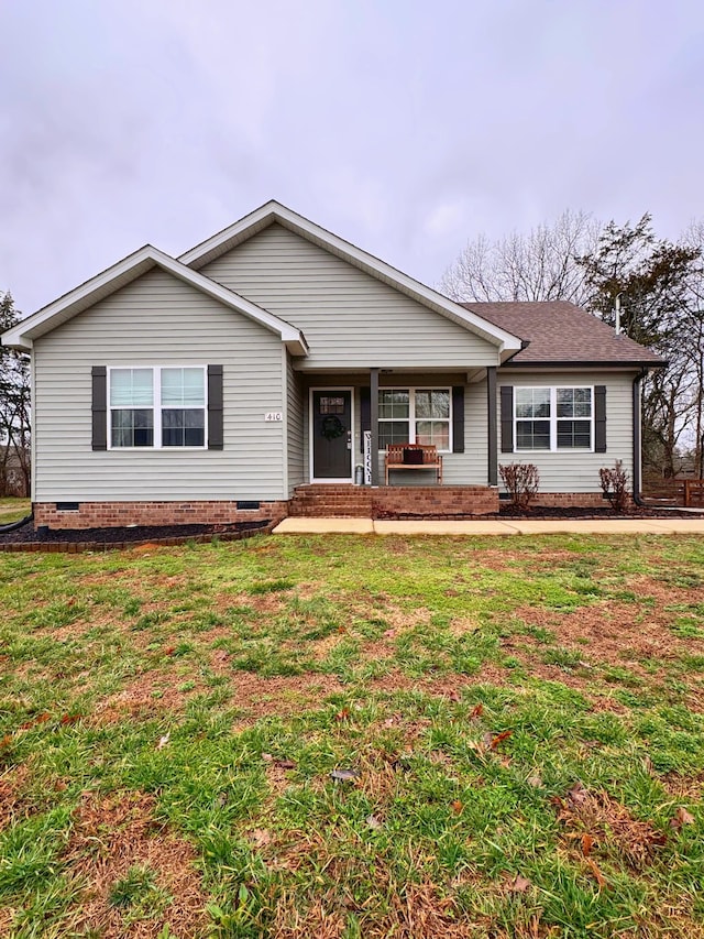 ranch-style house with a front yard