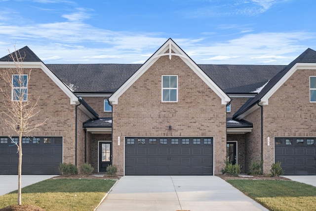 view of front facade with a garage and a front lawn