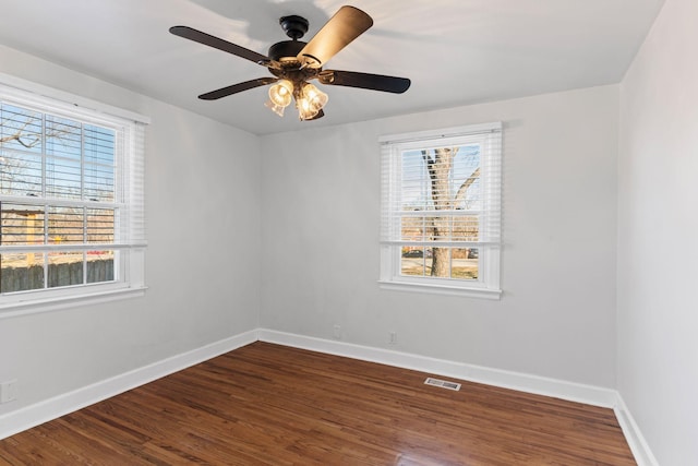 spare room featuring hardwood / wood-style flooring and ceiling fan