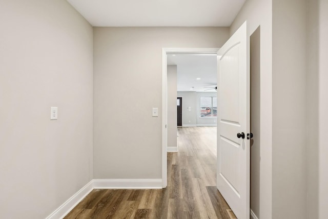 hallway featuring dark hardwood / wood-style flooring