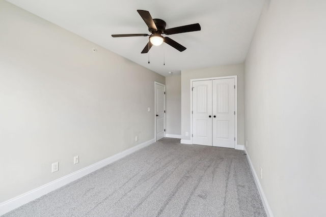 unfurnished bedroom with a closet, ceiling fan, and carpet