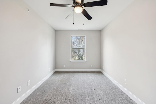 unfurnished room featuring ceiling fan and carpet floors