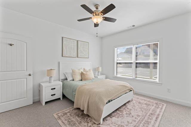 carpeted bedroom featuring ceiling fan