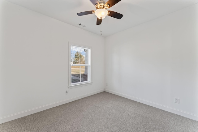 empty room with ceiling fan and carpet flooring