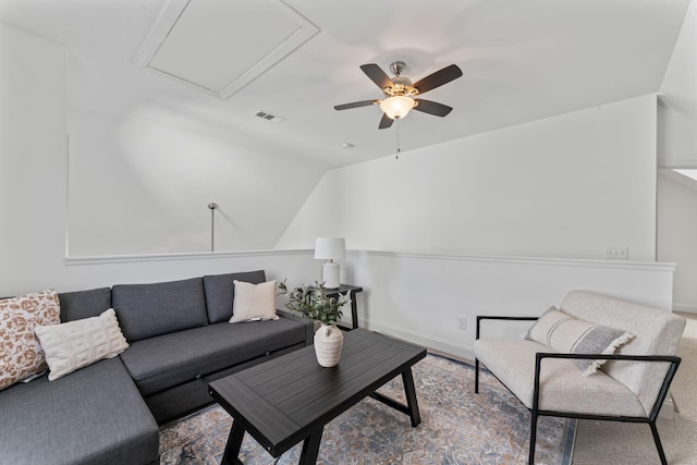 living room featuring vaulted ceiling and ceiling fan