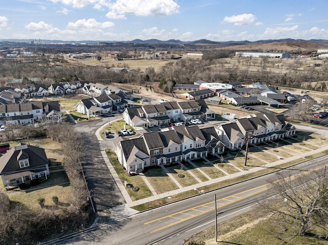 birds eye view of property with a mountain view