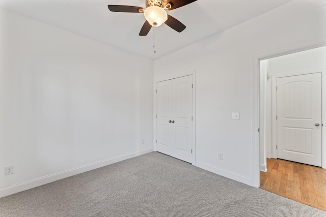 unfurnished bedroom featuring ceiling fan and carpet flooring