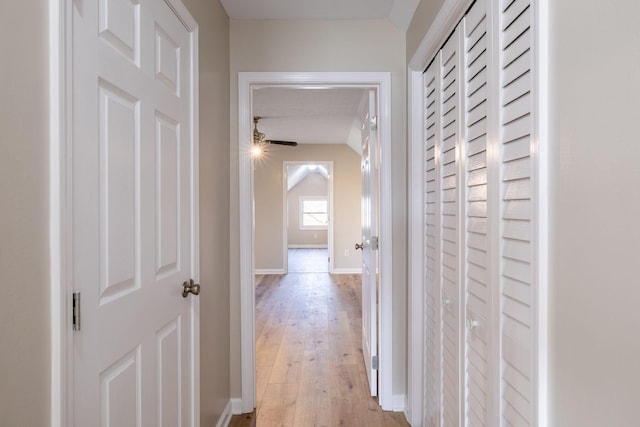 hall with light hardwood / wood-style floors