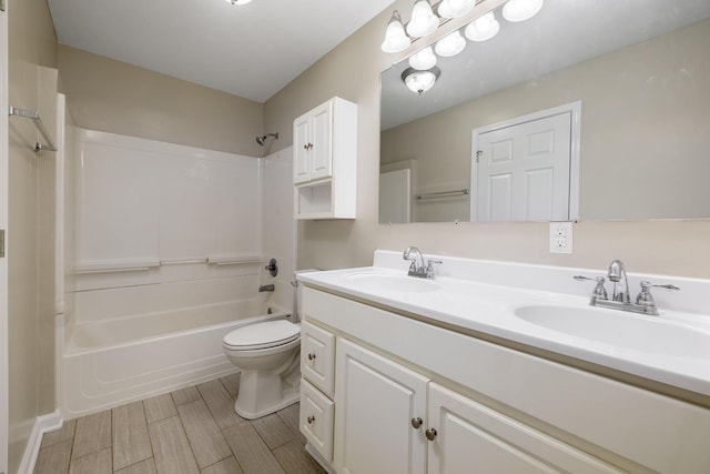 full bathroom with shower / bathing tub combination, vanity, and toilet