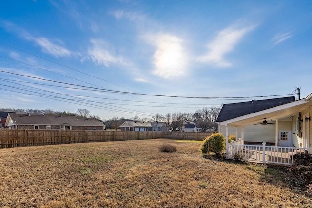 view of yard with ceiling fan