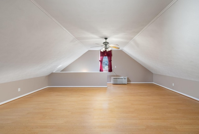 bonus room with lofted ceiling, light hardwood / wood-style floors, and ceiling fan