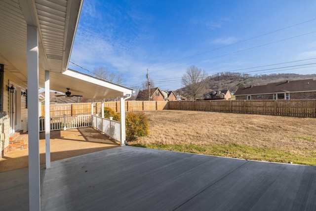 exterior space with ceiling fan