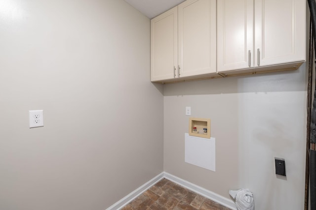 washroom with cabinets and hookup for a washing machine