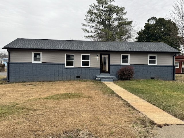 ranch-style house featuring a front lawn