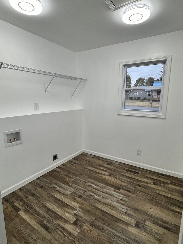 laundry area featuring dark hardwood / wood-style flooring and hookup for a washing machine