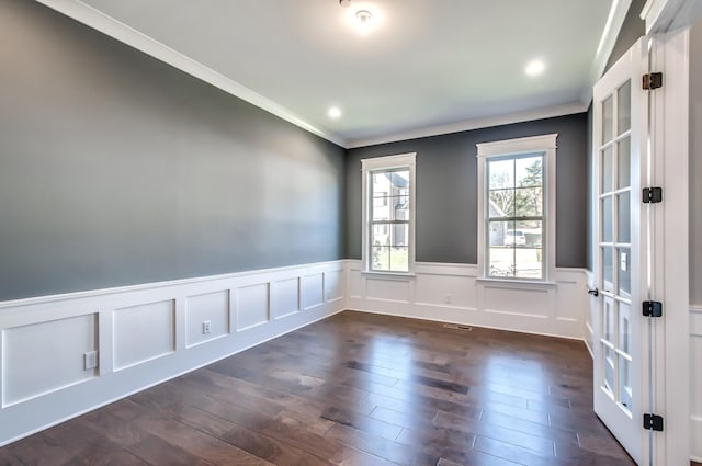 unfurnished room featuring ornamental molding and dark hardwood / wood-style flooring