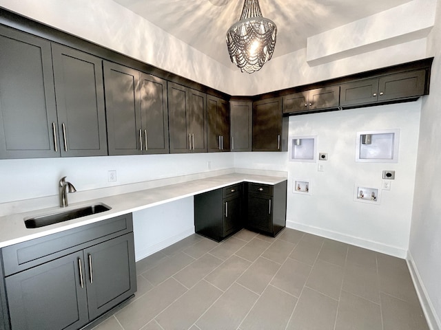 laundry room featuring sink, cabinets, light tile patterned floors, hookup for a washing machine, and hookup for an electric dryer