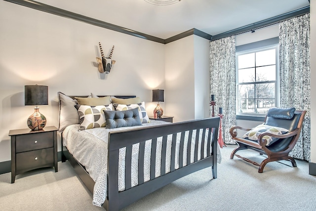 carpeted bedroom with crown molding