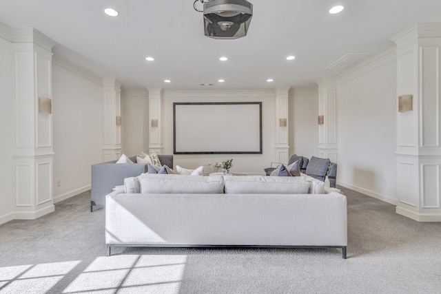 carpeted home theater with ornamental molding and ornate columns