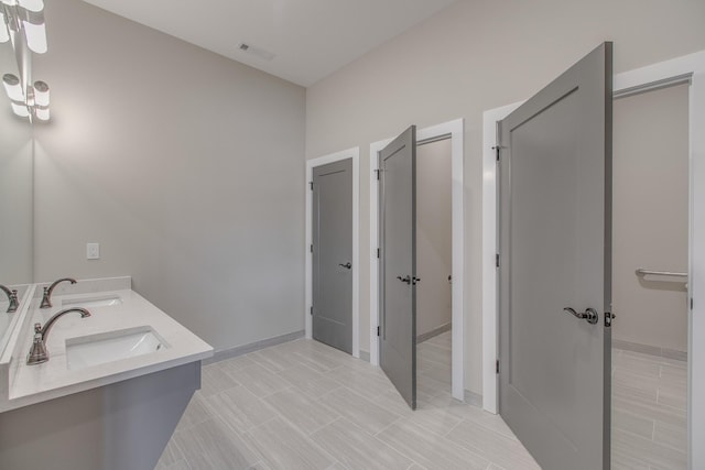 bathroom featuring vanity and tile patterned flooring