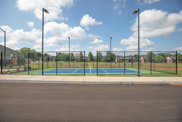 exterior space featuring tennis court