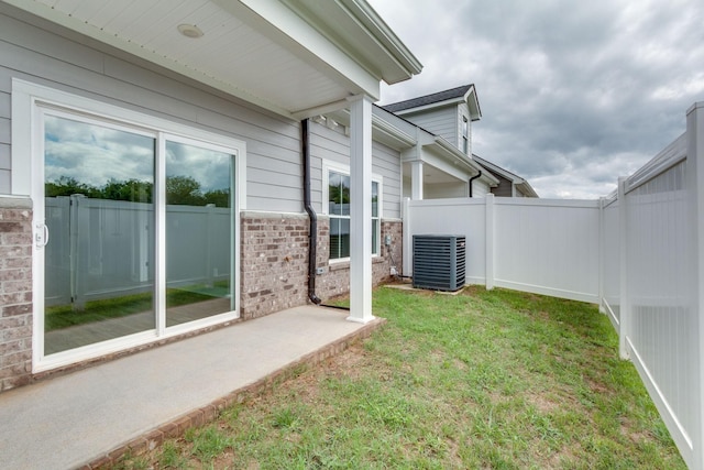 view of yard with a patio and central air condition unit