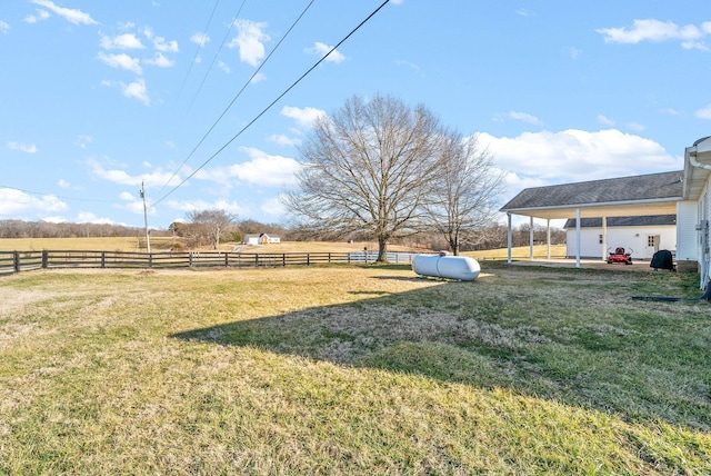 view of yard with a rural view