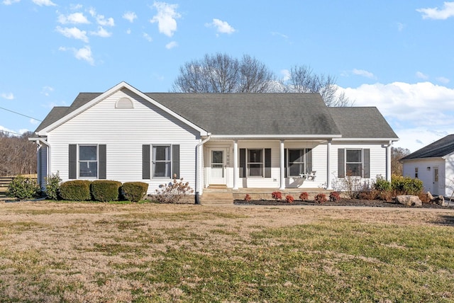 ranch-style house with a front lawn and covered porch