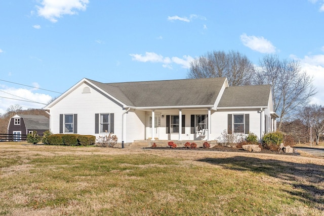 ranch-style house with covered porch and a front yard