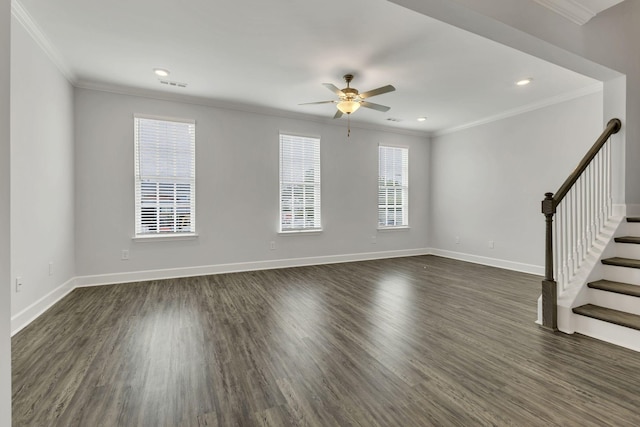 interior space with crown molding, plenty of natural light, and dark hardwood / wood-style floors