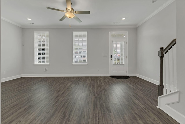 entryway with crown molding, ceiling fan, and dark hardwood / wood-style floors