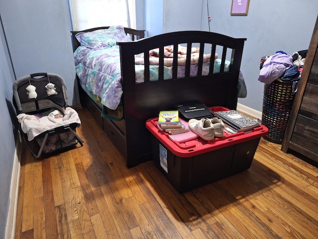 bedroom featuring wood-type flooring