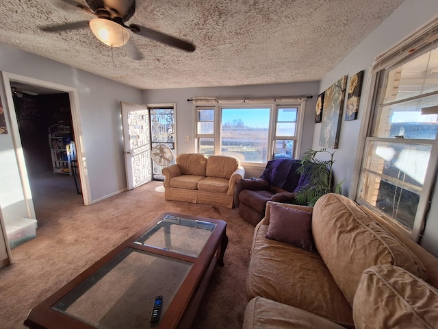 living room with ceiling fan, a textured ceiling, and carpet flooring