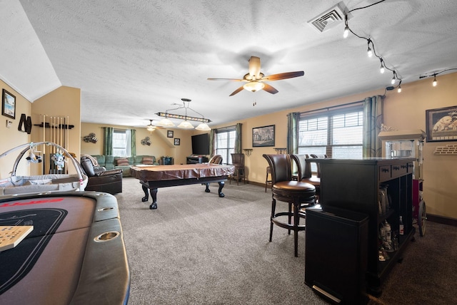 playroom featuring plenty of natural light, carpet floors, a textured ceiling, and ceiling fan