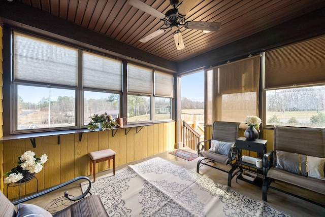 sunroom / solarium featuring ceiling fan