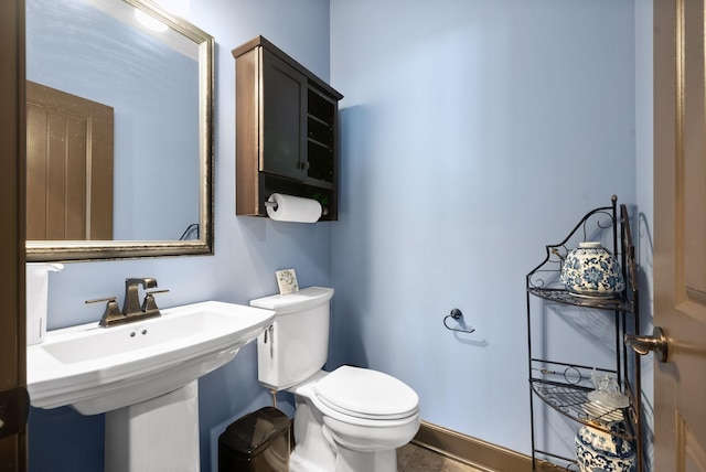 bathroom with sink and toilet