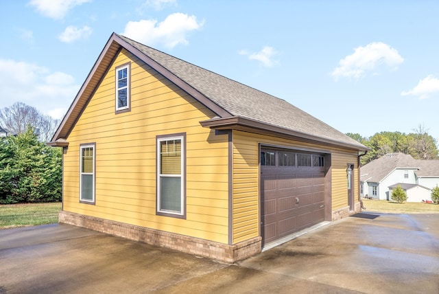 view of side of property featuring a garage