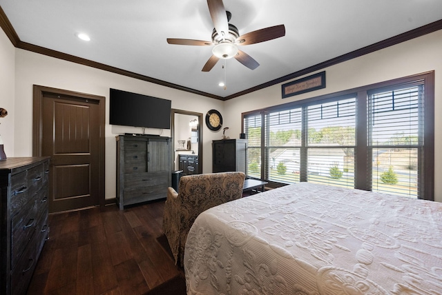 bedroom featuring ornamental molding, ceiling fan, dark hardwood / wood-style flooring, and ensuite bath