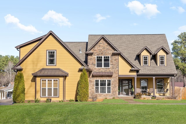 view of front of home featuring a porch and a front lawn