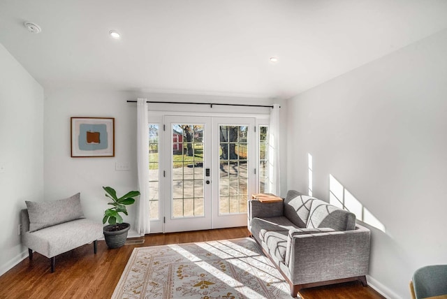 sitting room featuring hardwood / wood-style floors and french doors