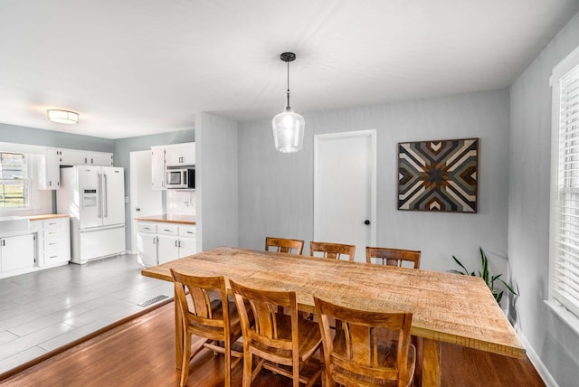 dining space featuring dark hardwood / wood-style flooring