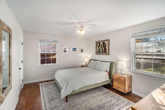 bedroom with dark wood-type flooring and ceiling fan